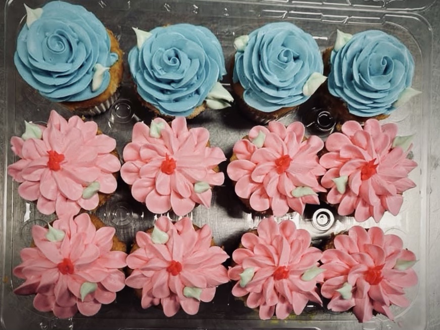 Cupcake with blue and pink flower frosting