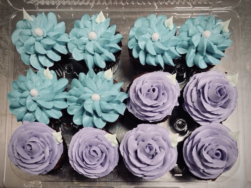 cupcakes with blue and violet flower frosting