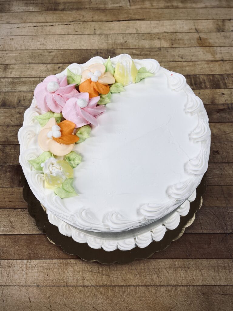 Cake with pink and orange flowers design