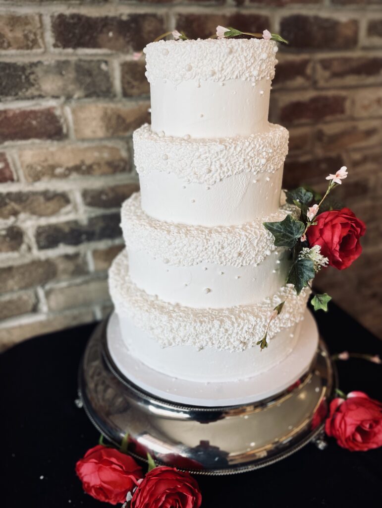 Four layer cake with rose