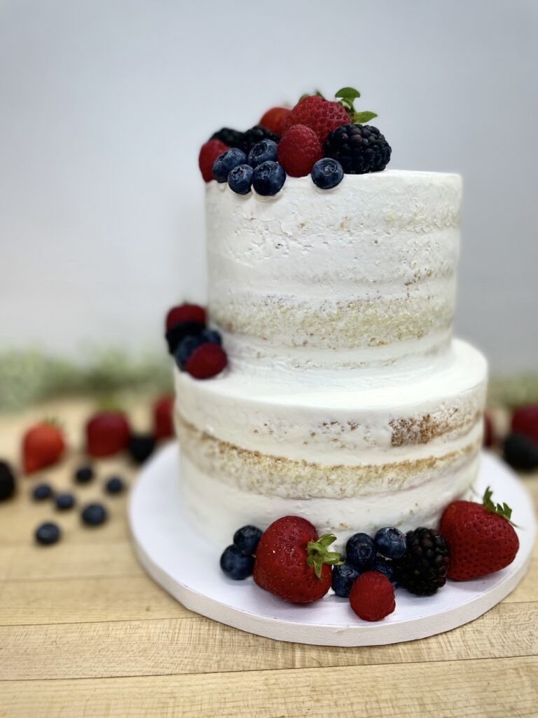 Two layer naked cake with berries
